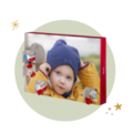 A creative wall picture with a cheerful child in a yellow coat and blue hat, framed with decorative elements.